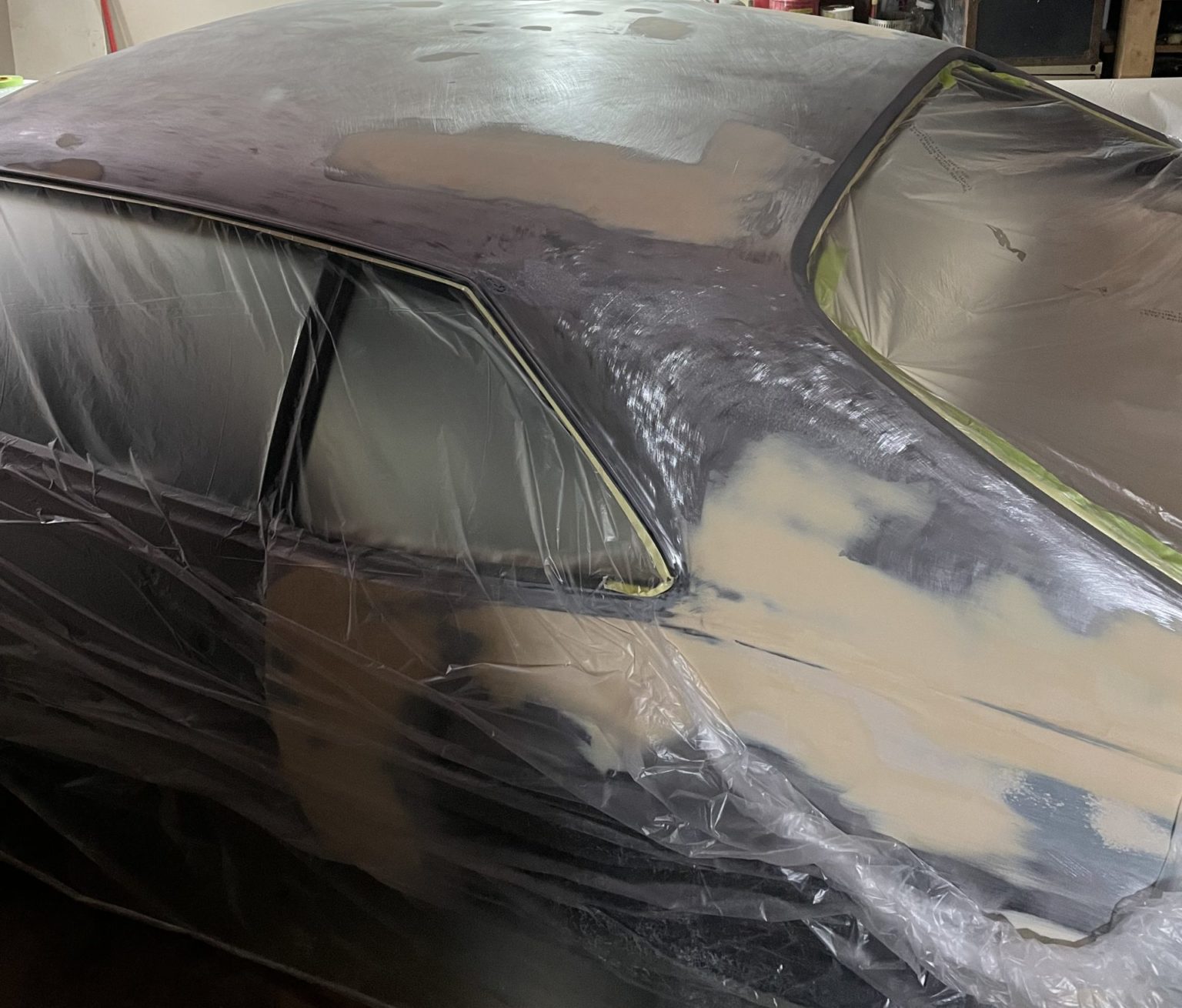 Vehicle masked and primed during a large autobody repair